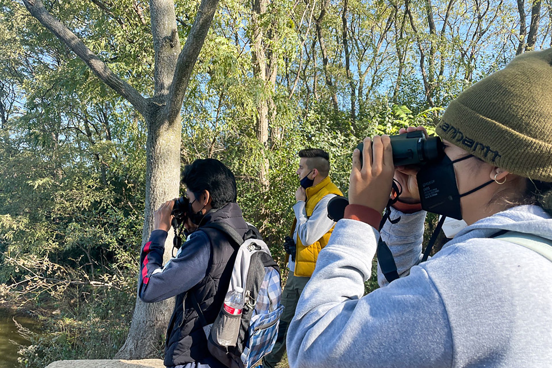 Chicago Park District students watch birds at the Big Marsh Park in Chicago as part of "small is all," a program that brings together art and the environment