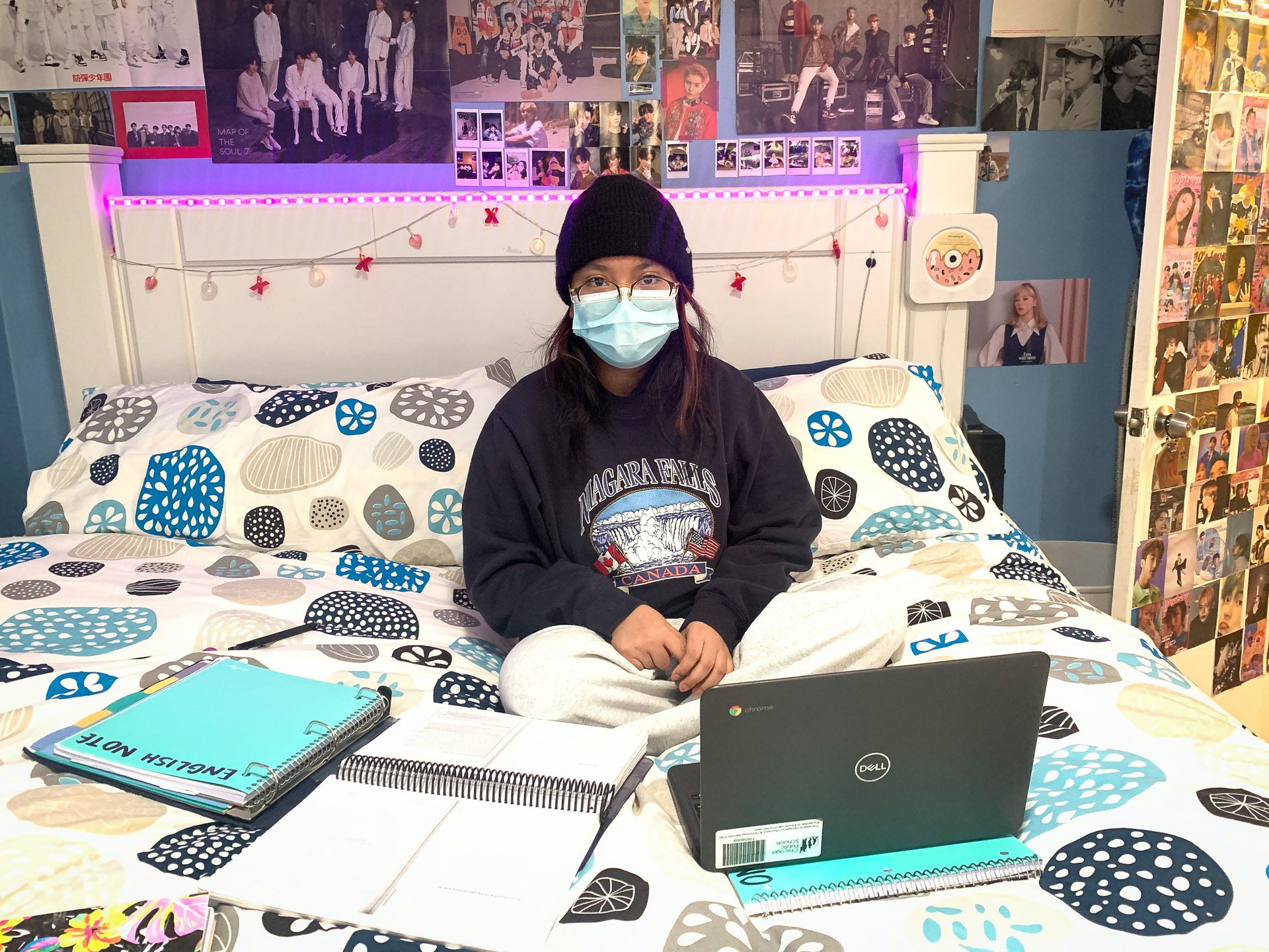 CPS student Gisselle Baltazar doing homework at home while class is canceled during COVID surge