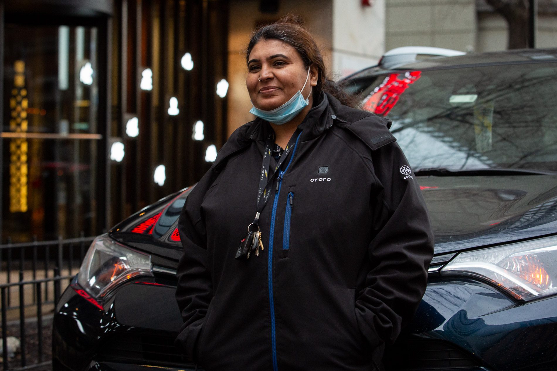 Ali Naveen in front of her car in downtown Chicago