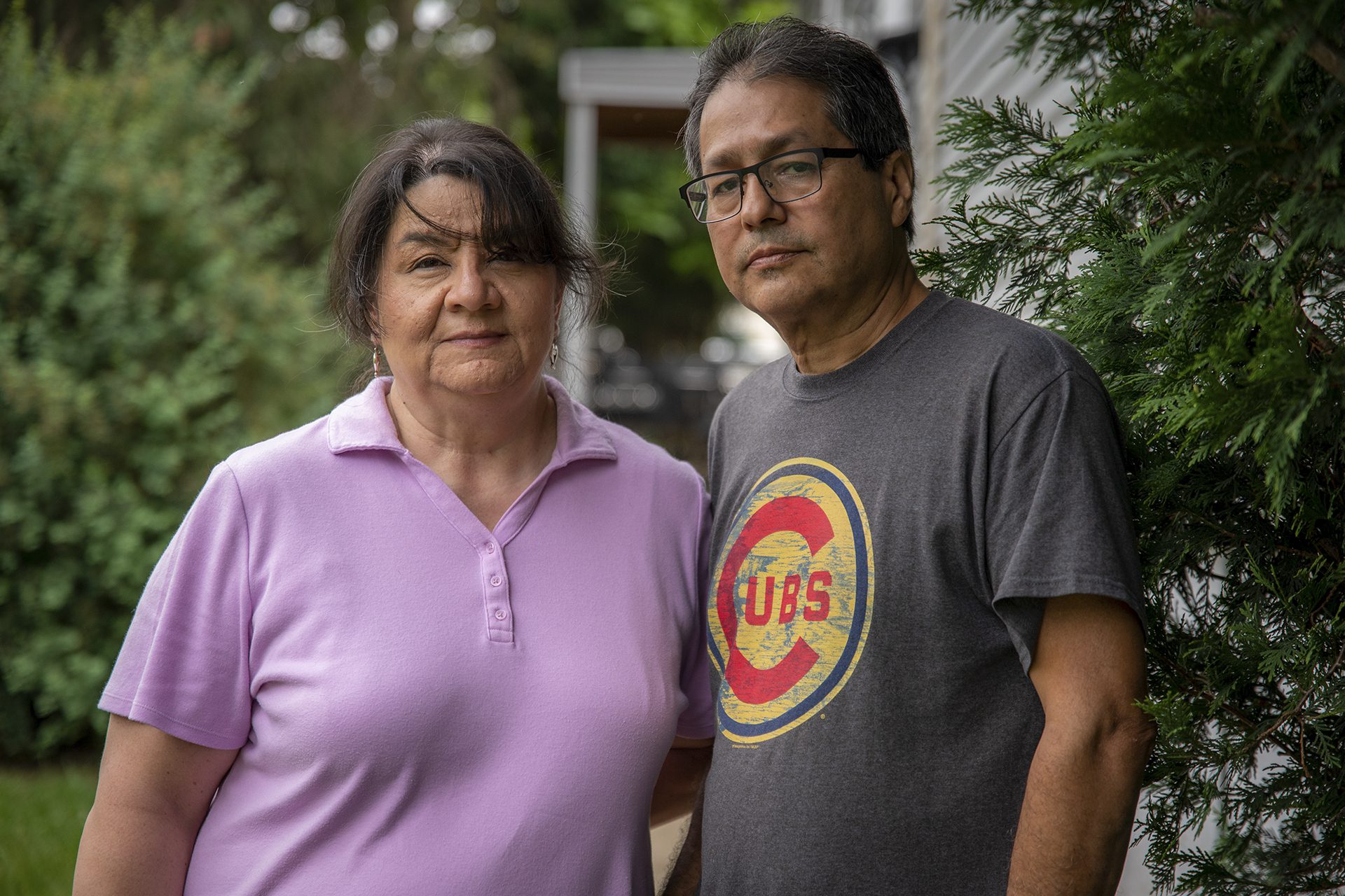 Sandra and Jesse Arzola in front of Sandra's family’s house in West Chicago