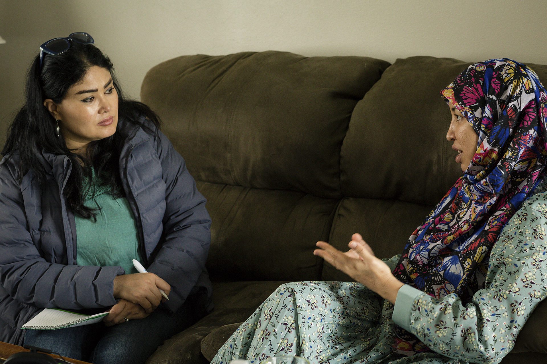 Saleha Soadat interviews former Afghan district governor Salima Mazari on a couch in her current home