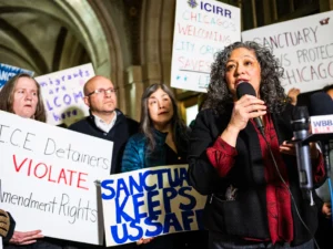 Beatriz Ponce de Leon, Deputy Mayor for Immigration, Migrant and Refugee Rights, speaks as protesters and local officials filled the lobby at City Hall Jan. 13, 2025 to rally in support of the city's Welcoming City ordinance in the face of Ald. Raymond Lopez (15th) and Ald. Silvana Tabares (23rd)’s proposed changes to the ordinance.