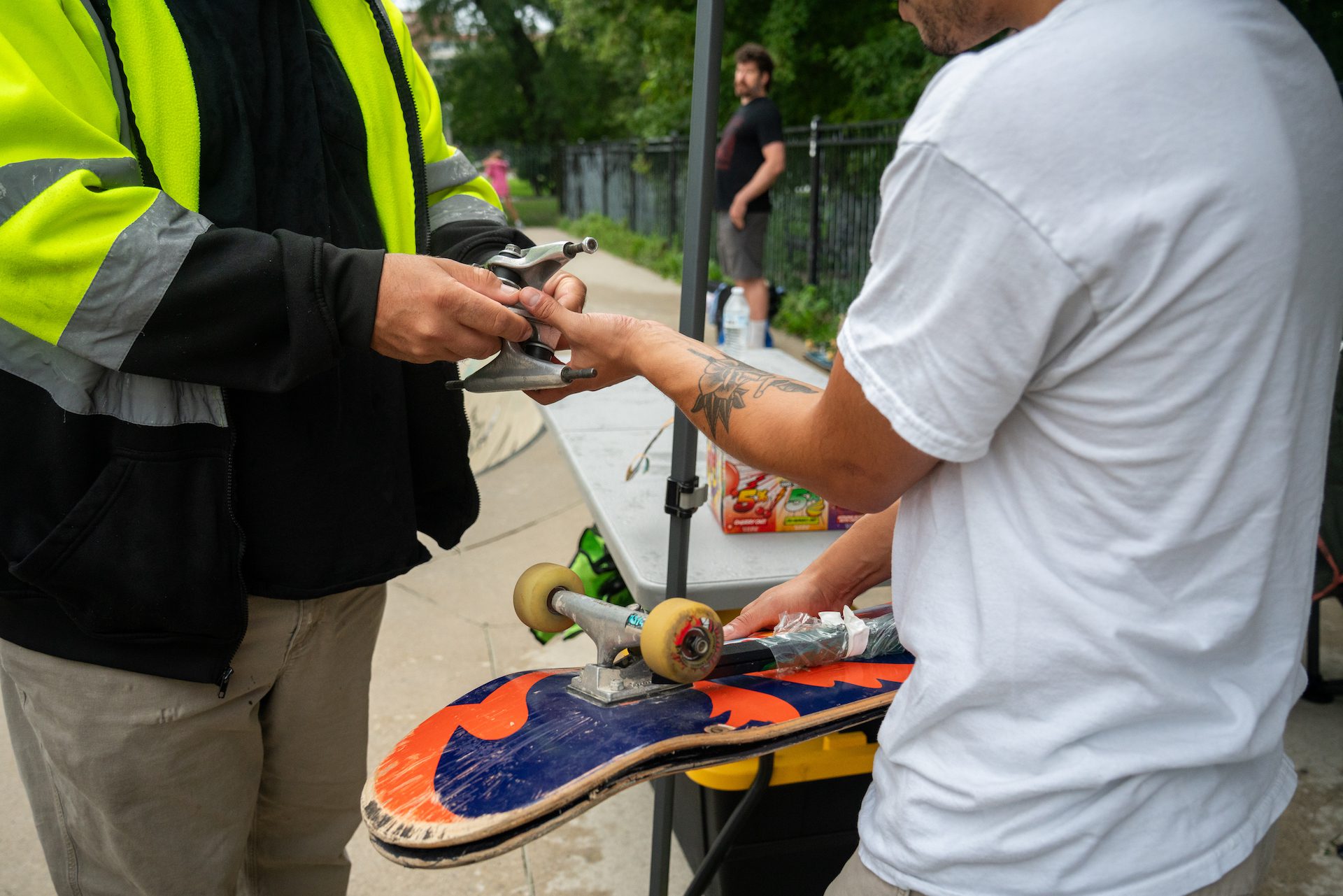 Javier receives a gear donation from Mark Slonina during a Boards Across Borders fundraising event in partnership with Wilson Wednesdays.