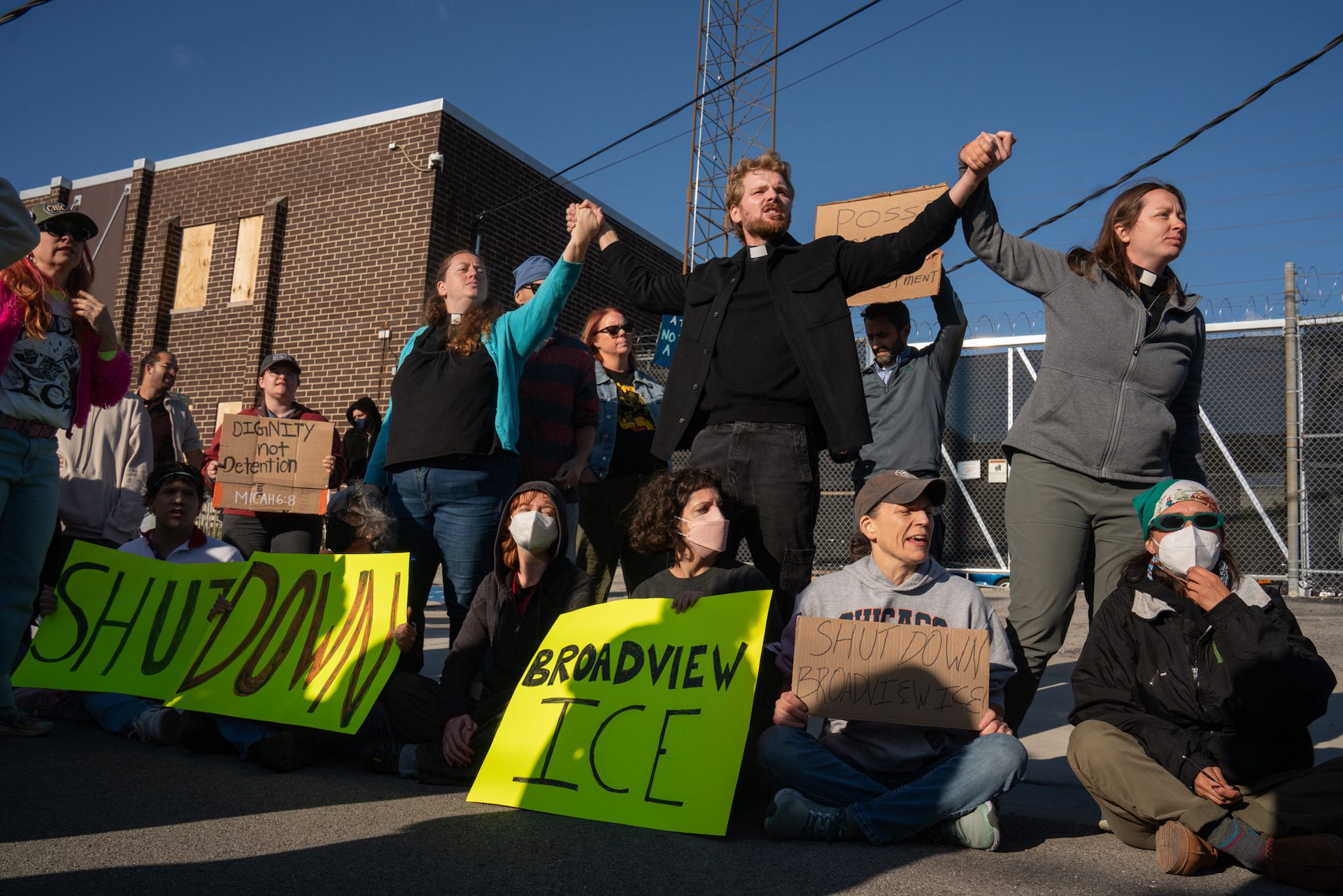 Pastor David Black (center) joins a group other protesters holding hands as they block the entrance of the ICE processing facility at 1930 Beach St. in Broadview, Ill.,during a demonstration on Friday, Sept. 5, 2025.