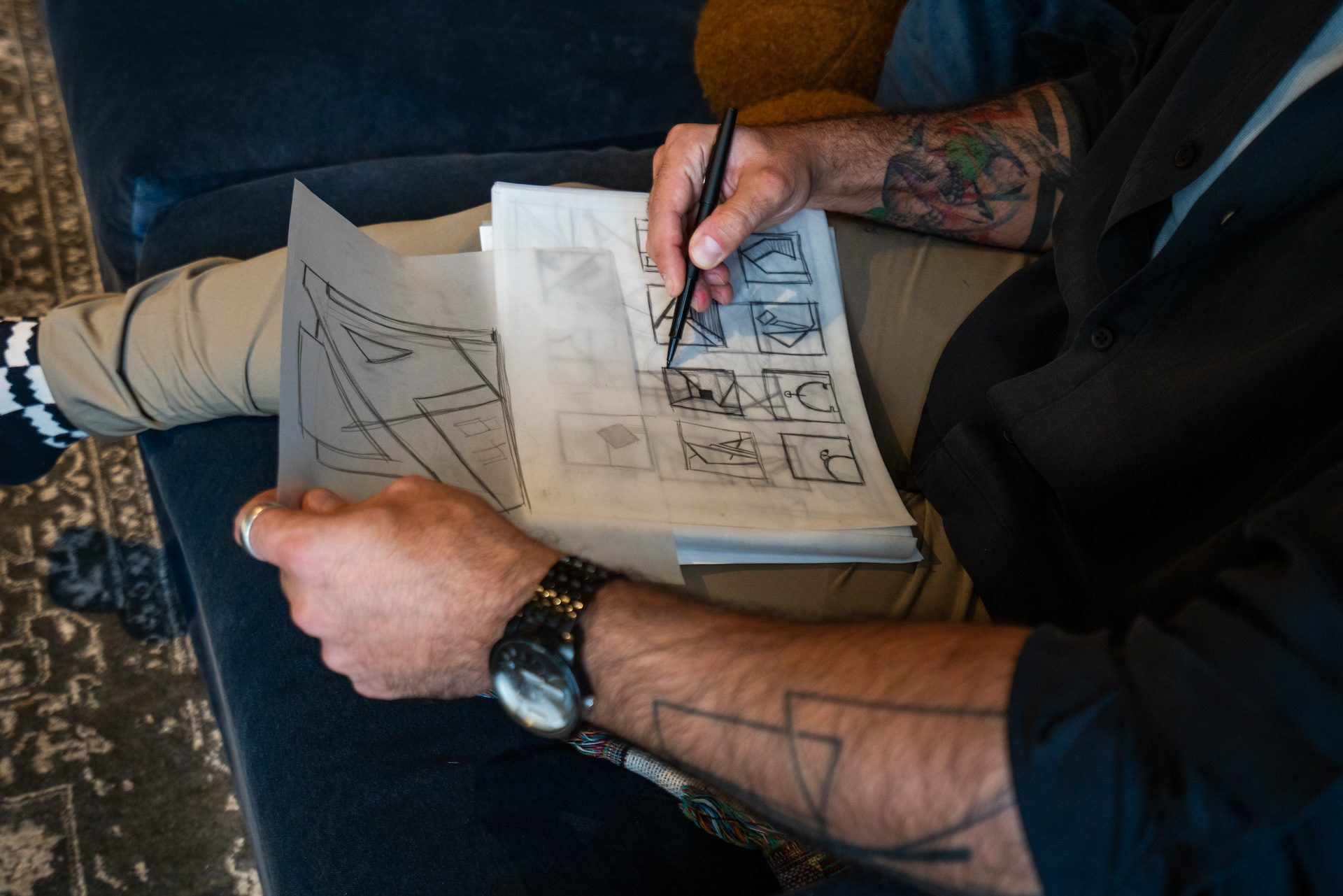 A close up image shows interior Designer Toufic Alayyash sketching inside his home office on Nov. 10, 2025.