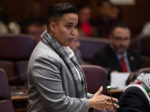 Ald. Jessie Fuentes (26th) stands up inside City Hall as she explains a new measure that states that the Civilian Office of Police Accountability (COPA) can investigate complaints against Chicago Police officers coordinating with federal immigration agents during a city council meeting on March 18, 2026.