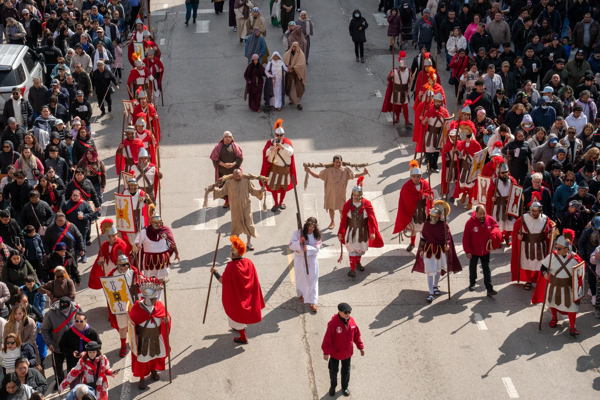 Hundreds of spectators on 18th Street are seen from above during the 49th annual Via Crucis procession on Good Friday in Pilsen.