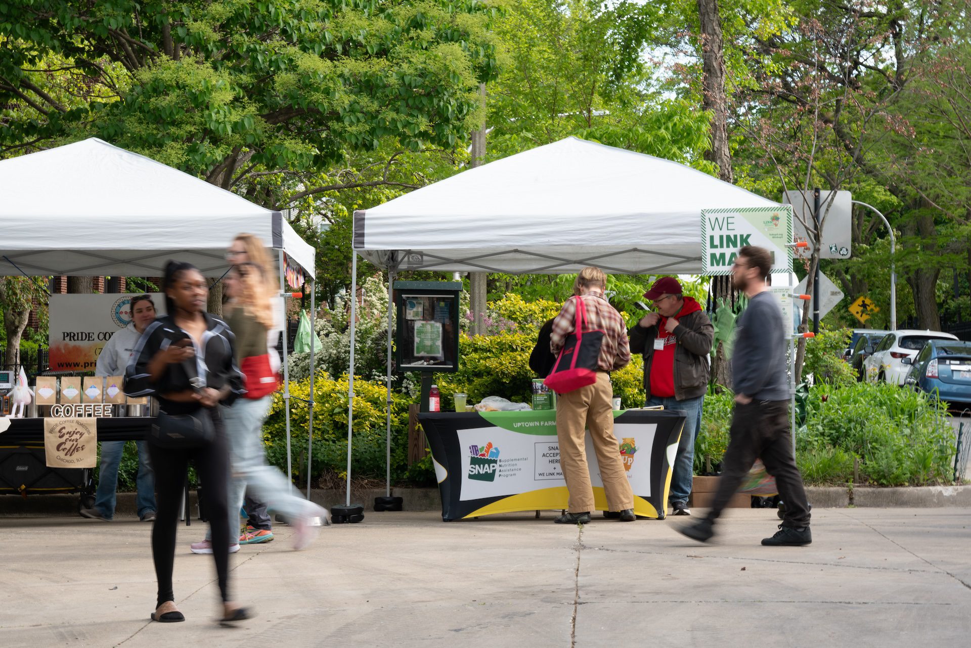 A farmer's market shopper stops the SNAP tent.