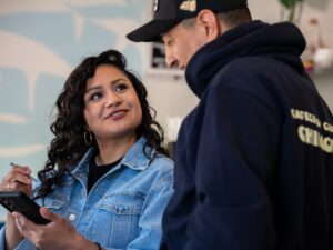 Rocio Villalva looks at Omar Contreras while reviewing a video with Omar Contreras at Dulce De Leech Cafecito in Roscoe Village on Monday, May 11, 2026.