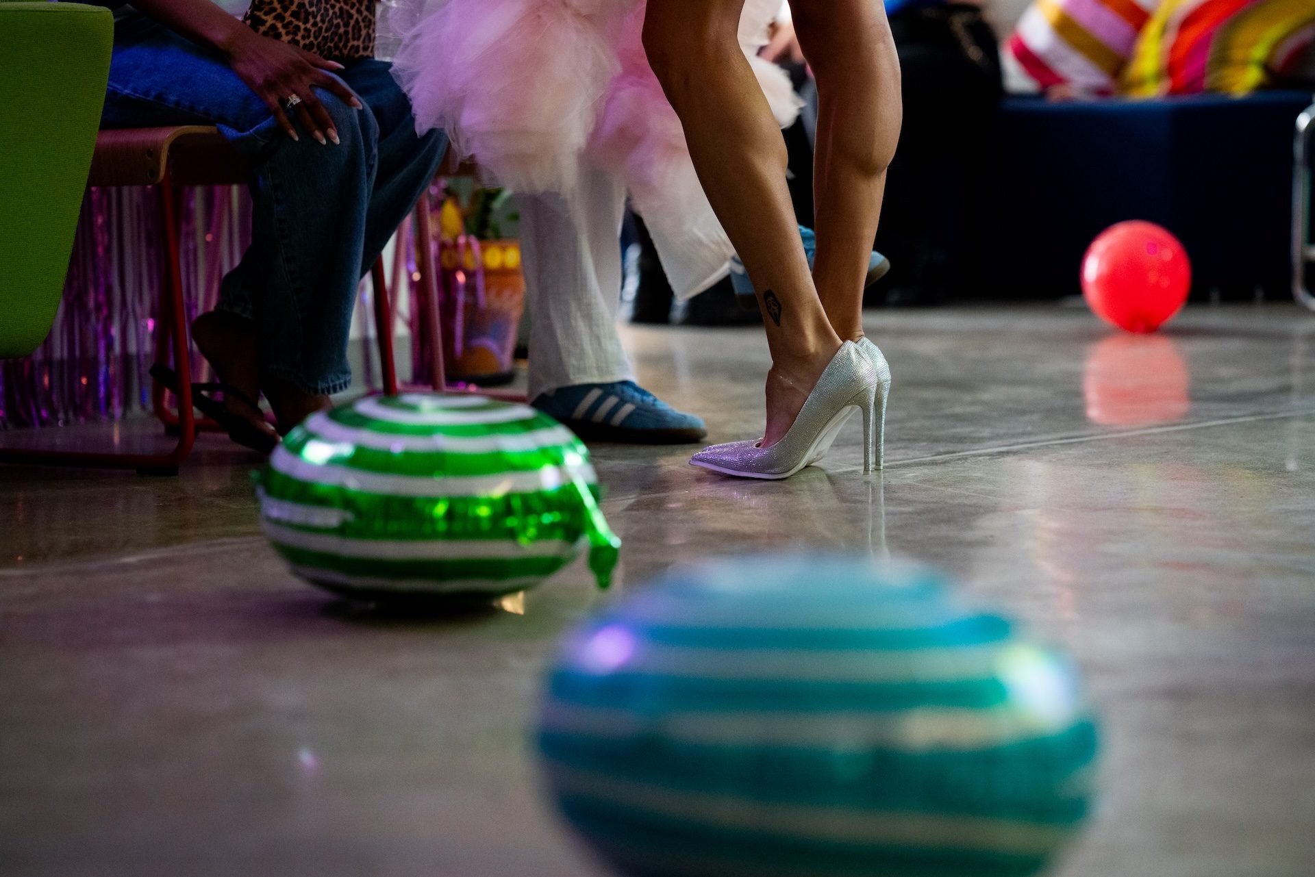 Balloons lay on the dance floor at the Queer Prom, which had the theme Yollocalli intern Diamond Galindo was inspired by Katy Perry’s “California Girls” music video which featured bright colors and giant candy set pieces.