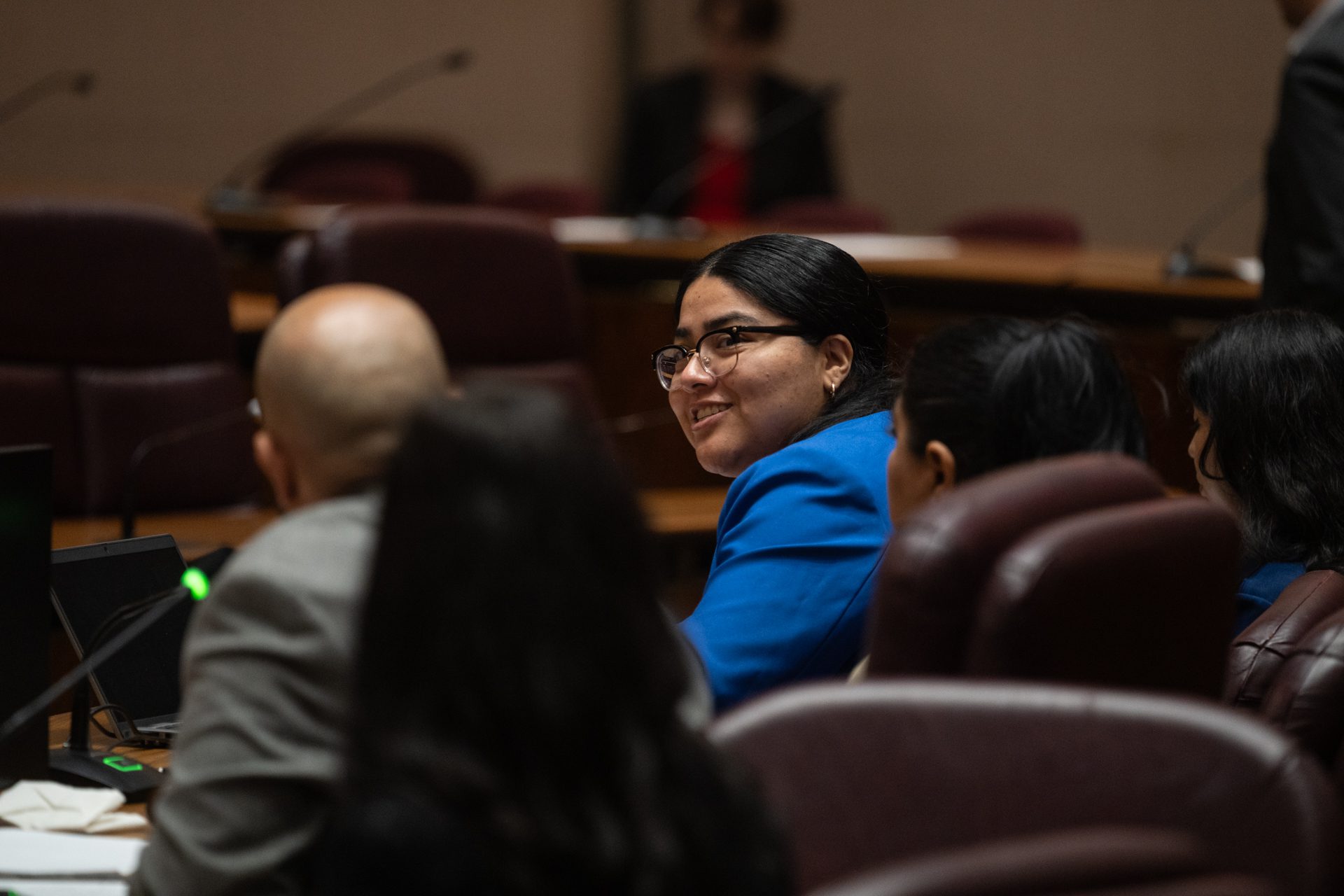 Cecilia Mendoza, associate director of government relations at the National Immigrant Justice Center, smiles as she responds to Ald. Vasquez (40th) during a Committee on Immigrant and Refugee Rights hearing on DACA on June 11, 2026.