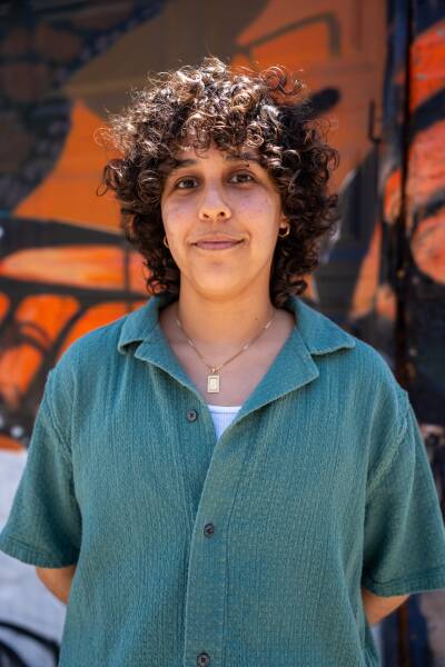 Thais Beltran, founder of Nuestro Chicago Archives, stands in front of a mural near the Lozano Branch Library in Pilsen on May 23, 2026.