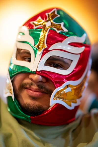 David Rosa wears a red, green, and gold luchador mask at the Mexico vs. South Korea World Cup watch party at Monochrome Brewing.
