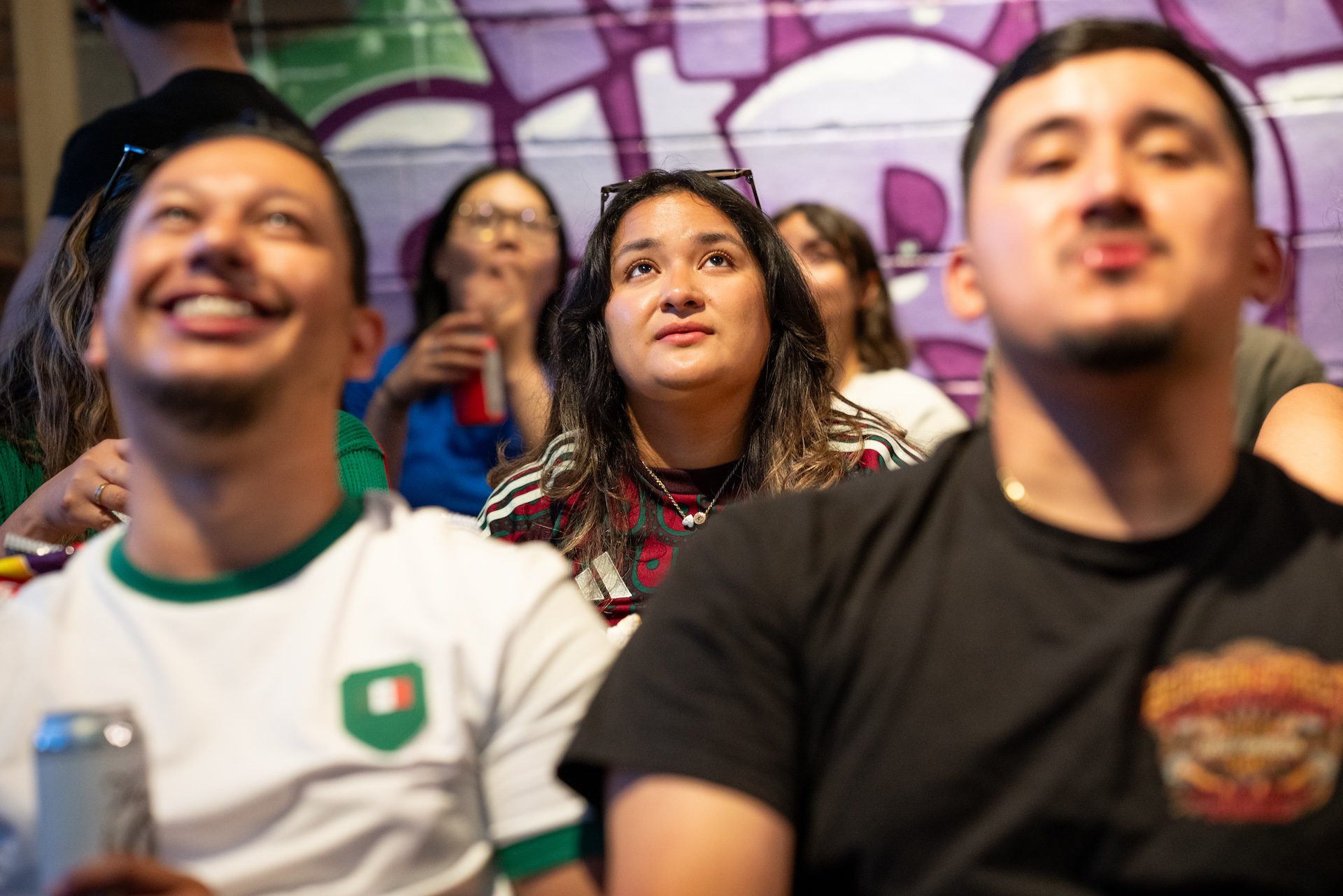 Spectators watch in suspense as Mexico intercepts an attempted goal from South Korea during the World Cup watch party at Monochrome Brewing.