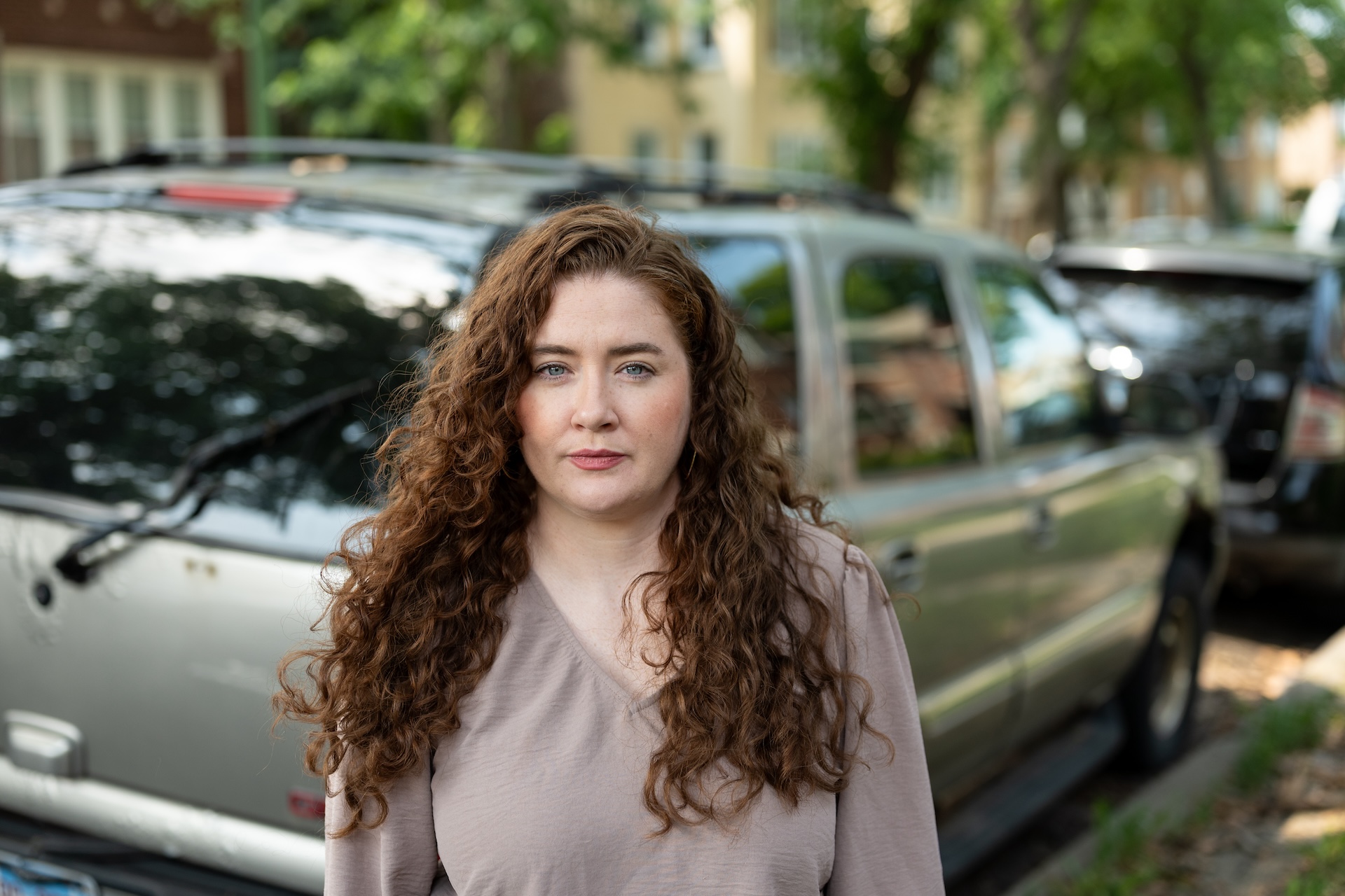 Deirdre O'Connor stands on the grass in front of her brother’s vehicle, which was left in West Ridge and has to be moved every seven days in order for it not to be reported abandoned. Her brother who is a legal permanent resident in the U.S., was denied entry to the U.S. back in September and is currently living in Ireland.