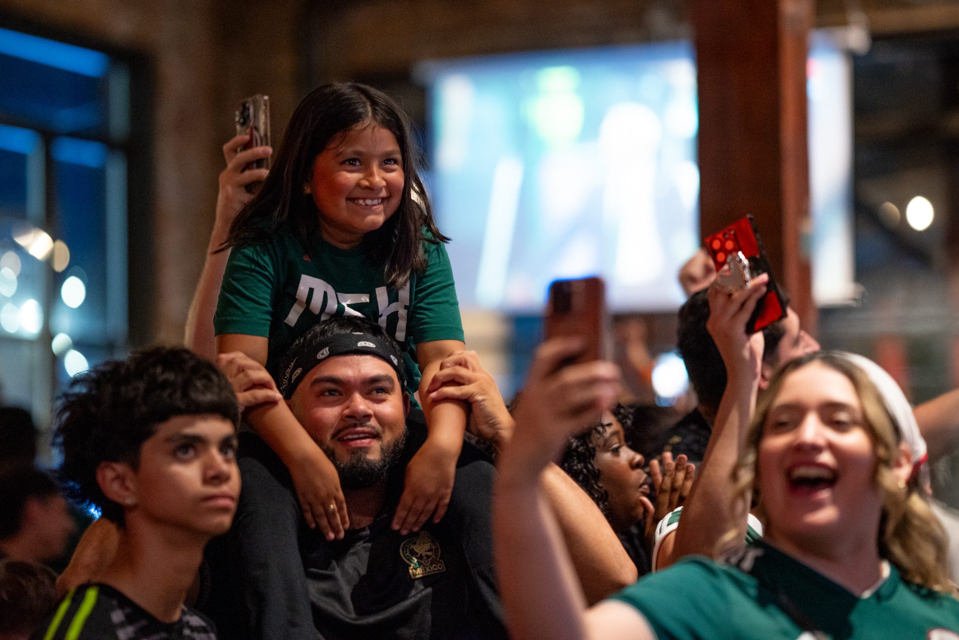 Spectators smile and they celebrate Mexico winning against South Korea during the World Cup watch party at Monochrome Brewing in Pilsen.