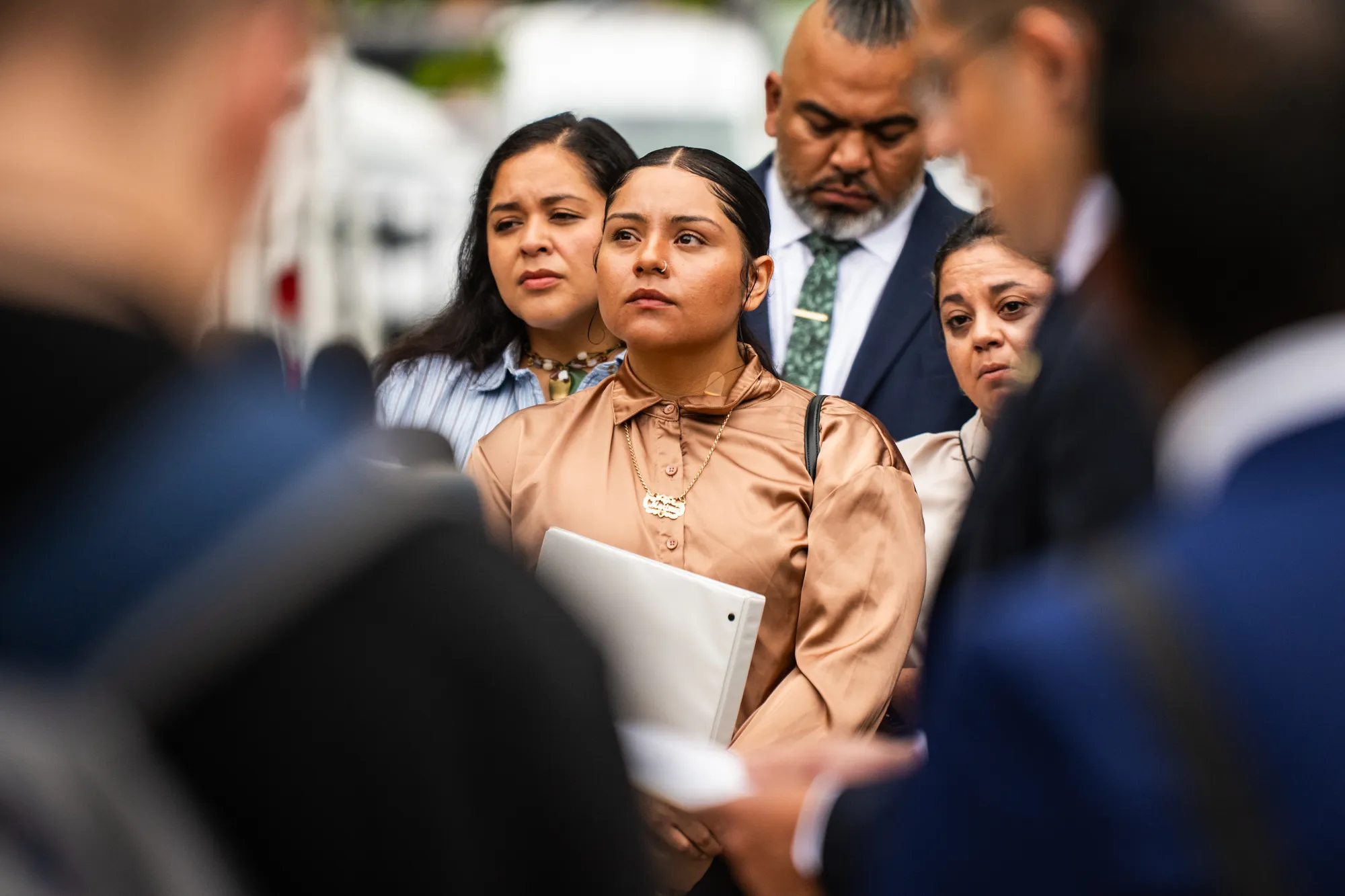 Federal agent shooting victim Marimar Martinez looks on as elected officials, attorneys, community leaders, and victims from Operation Midway Blitz hold a press conference on Aug. 10, 2026 outside the Chicago Police Department at 2452 W. Belmont Ave. in North Center.