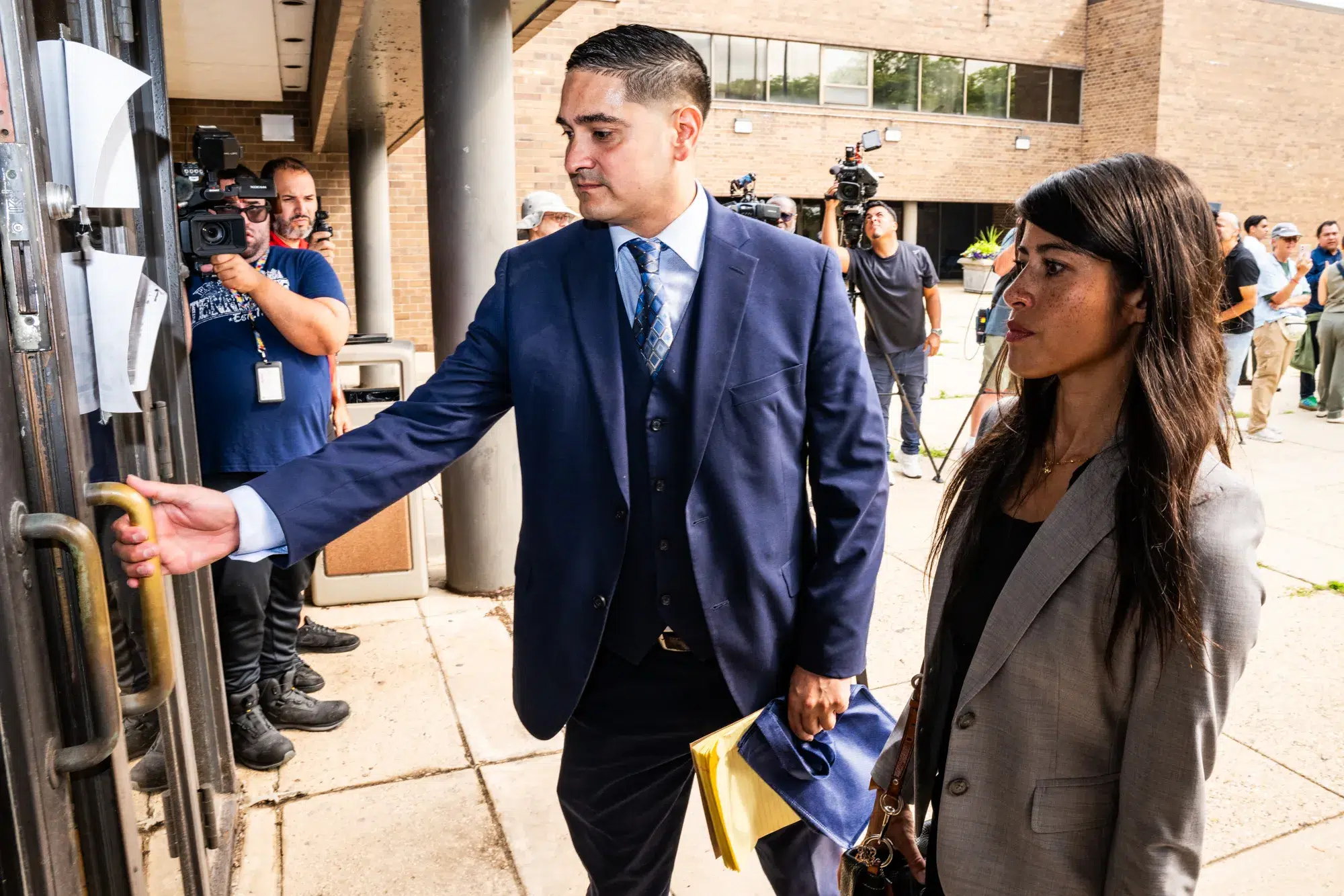 Brian Orozco arrives at the Chicago Police Department at 2452 W. Belmont Ave. in North Center ahead of filing police reports with the Chicago Police Department that allege crimes committed by ICE agents on Aug. 10, 2026.