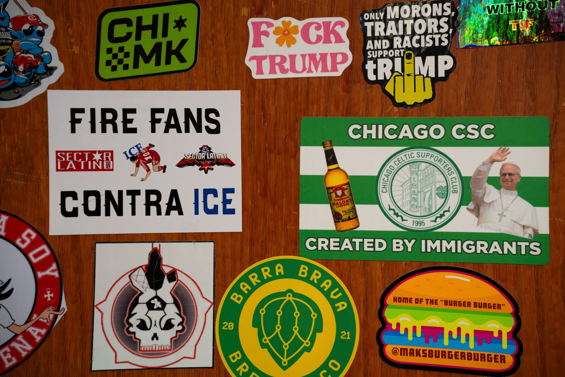 Several stickers repping local organizations and social justice causes cover the hosting stand at Marz Community Brewing Company’s Mothership location.
