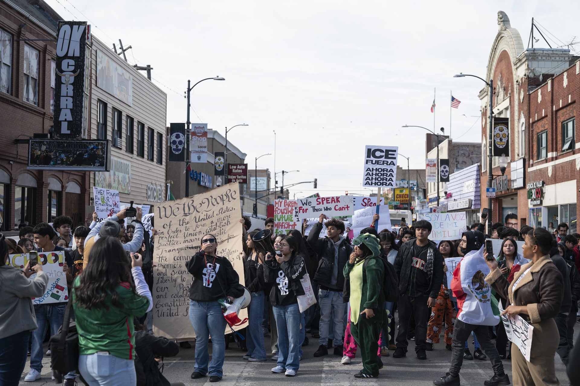 A large group of students from Little Village Lawndale High School march down 26th Street in Little Village.