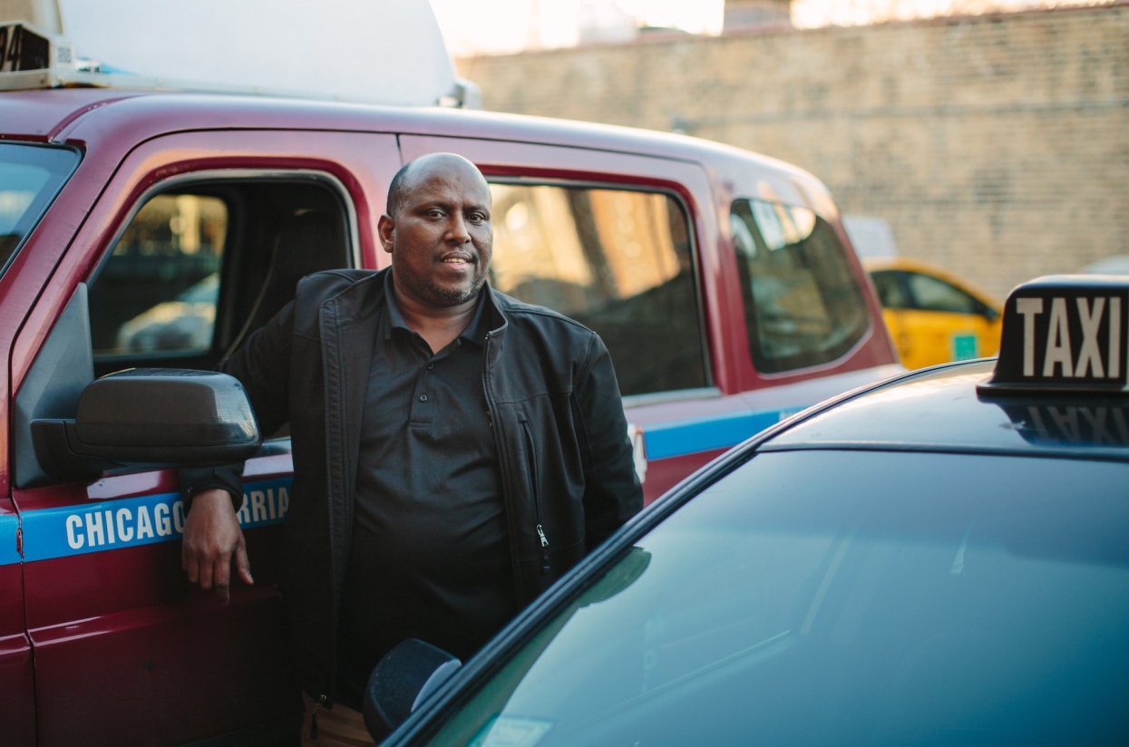 Abdinasir Kahim poses for a portrait outside of the Somali restaurant Bismilahi on the near north side.