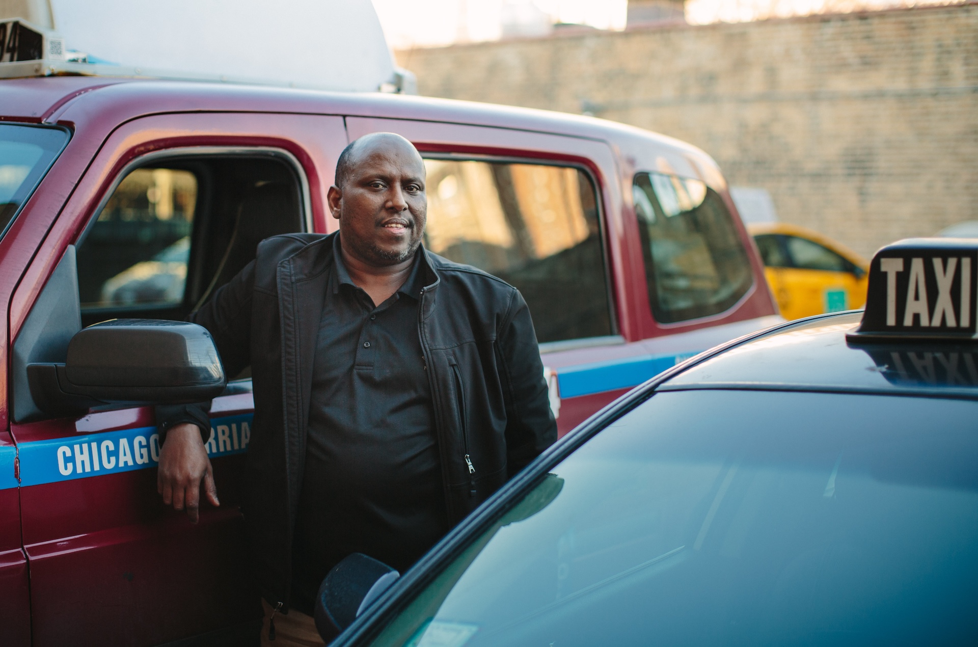Abdinasir Kahim poses for a portrait outside of the Somali restaurant Bismilahi on the near north side.