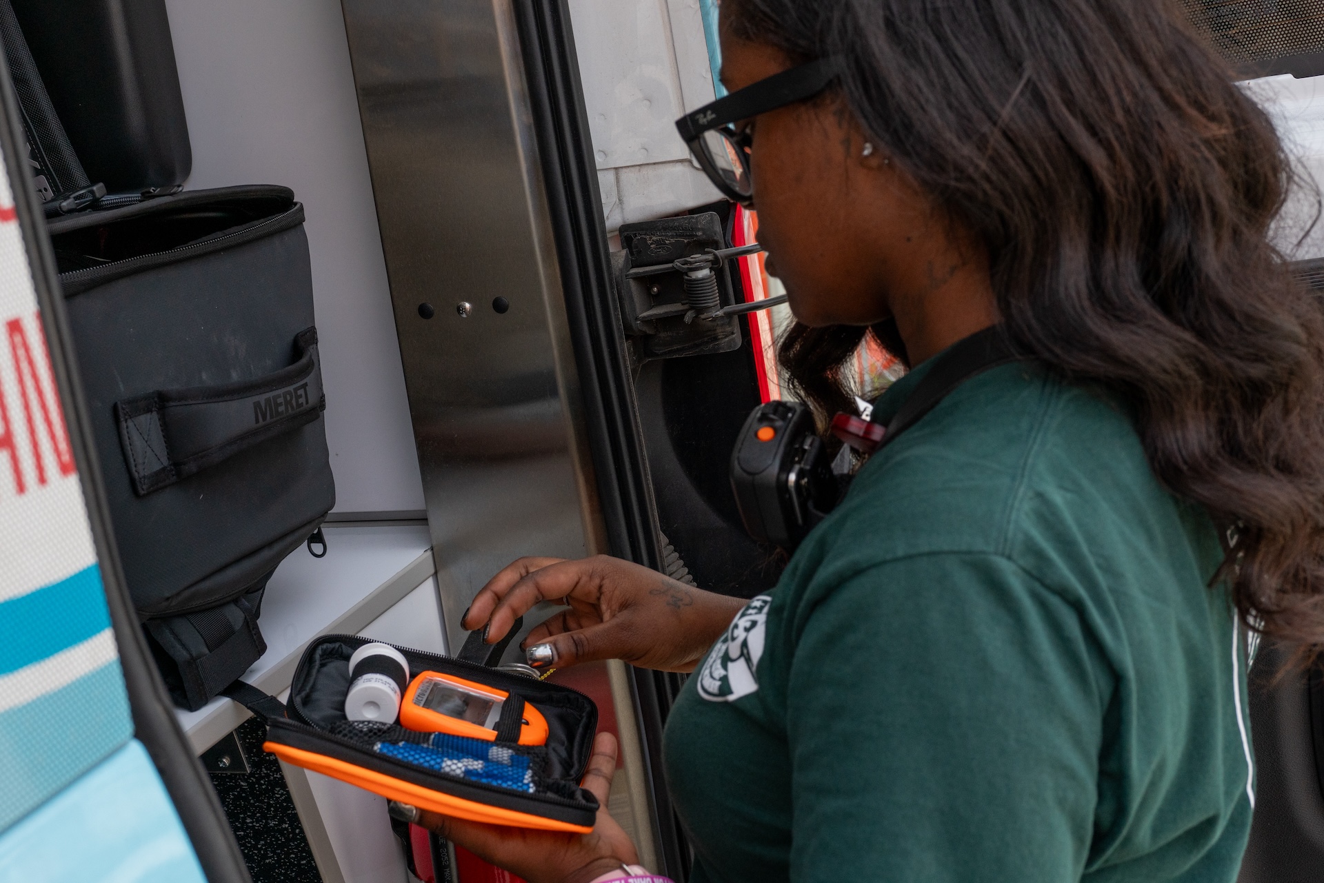 EMT Simone Nelson holds a medical kit as she checks that the medical bag packed in the CARE van is stocked with all necessary supplies before heading out on a shift on Sept. 14, 2026.