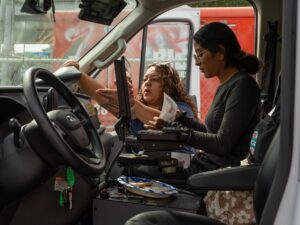 Dr. Melissa Argüelles (left) and EMT Marta Green (right) look over paperwork inside the CARE (Crisis Assistance Response and Engagement) van before heading out for a shift on Sept. 14, 2026.