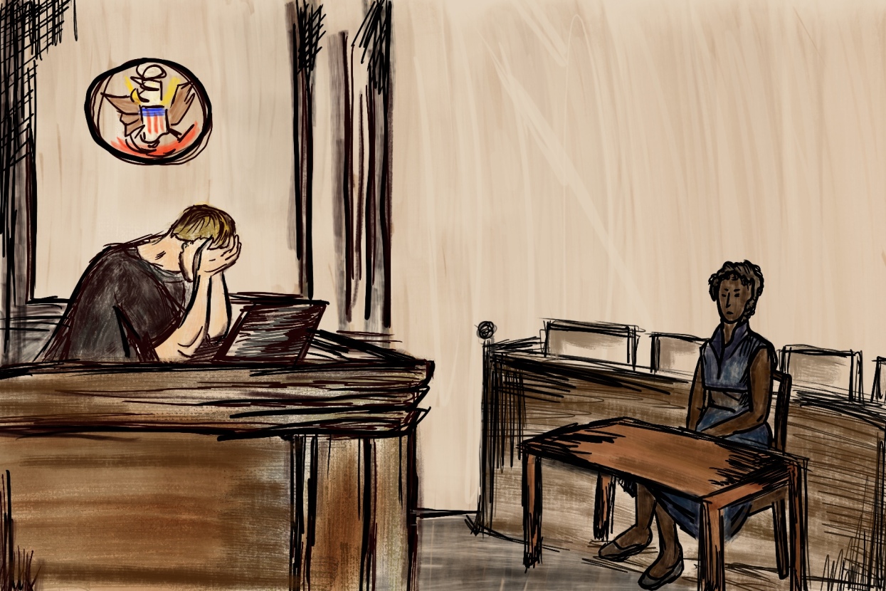 A middle-aged woman speaks to a judge who puts his hands on his head in frustration as there are no court room interpreters.