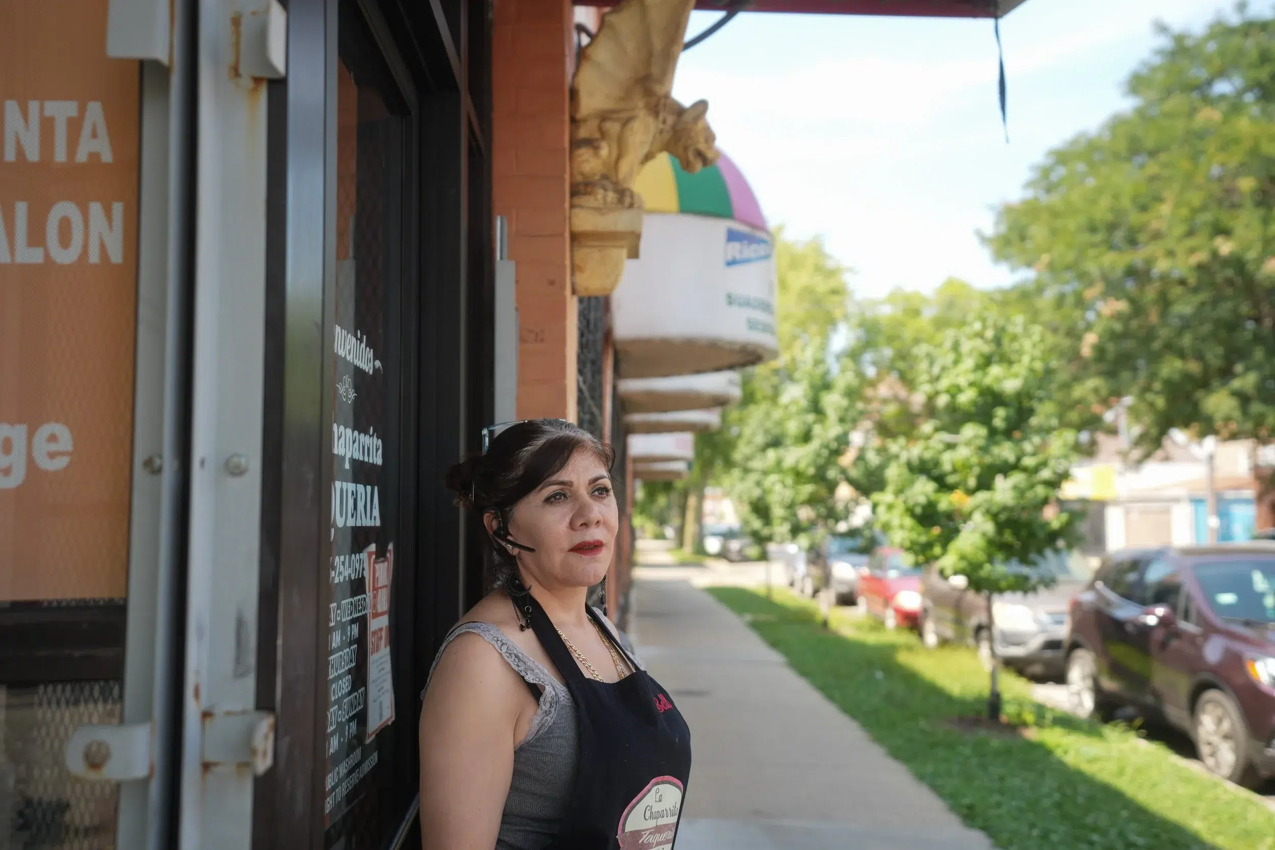 Angelina Mendez, the owner of La Chaparrita Grocery, stands outside of her store in Little Village.