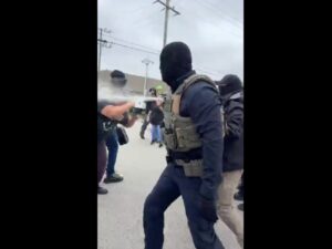 Federal agents wearing masks use pepper spray on protesters outside the Broadview immigration processing facility on Sept. 19, 2026.